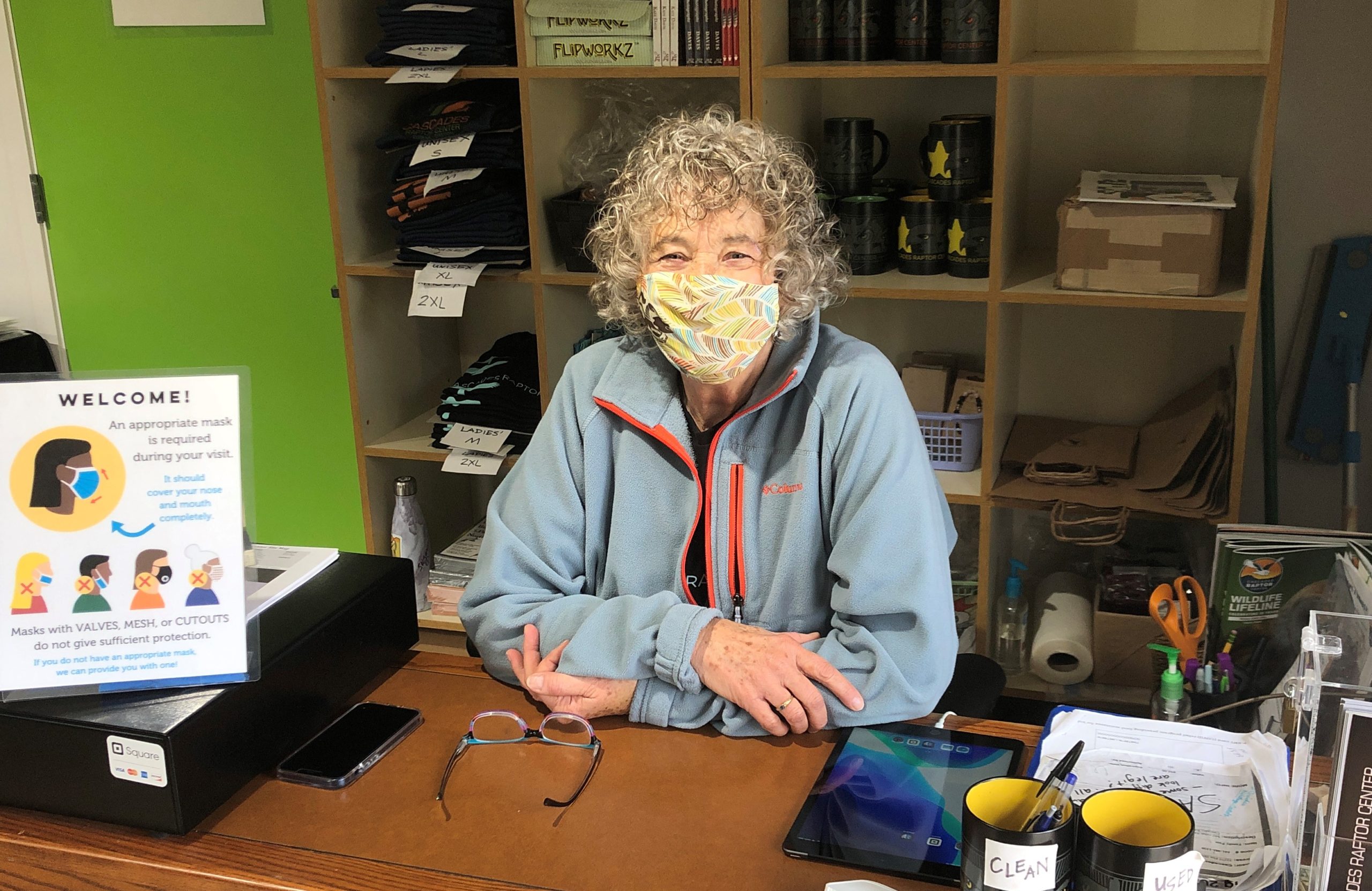 A volunteer greeter working in the visitor center